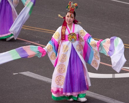 Korean dancer in royal uniform performs at the 2013 Rose Parade.